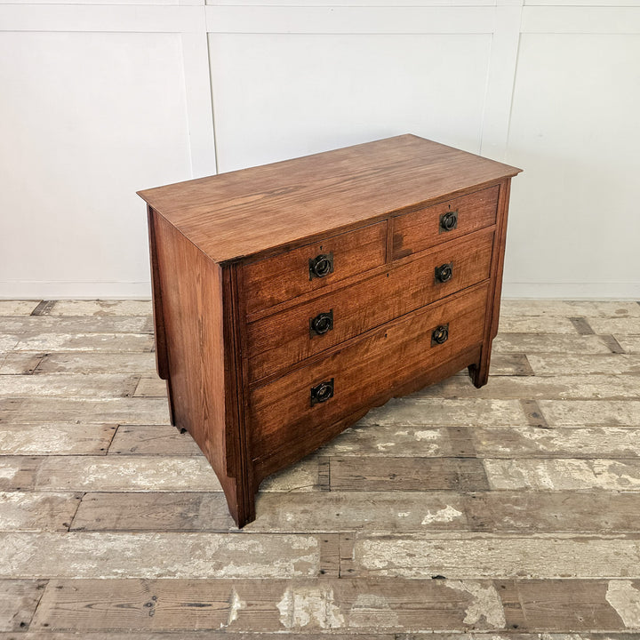 Oak chest with four drawers and reed moulded legs
