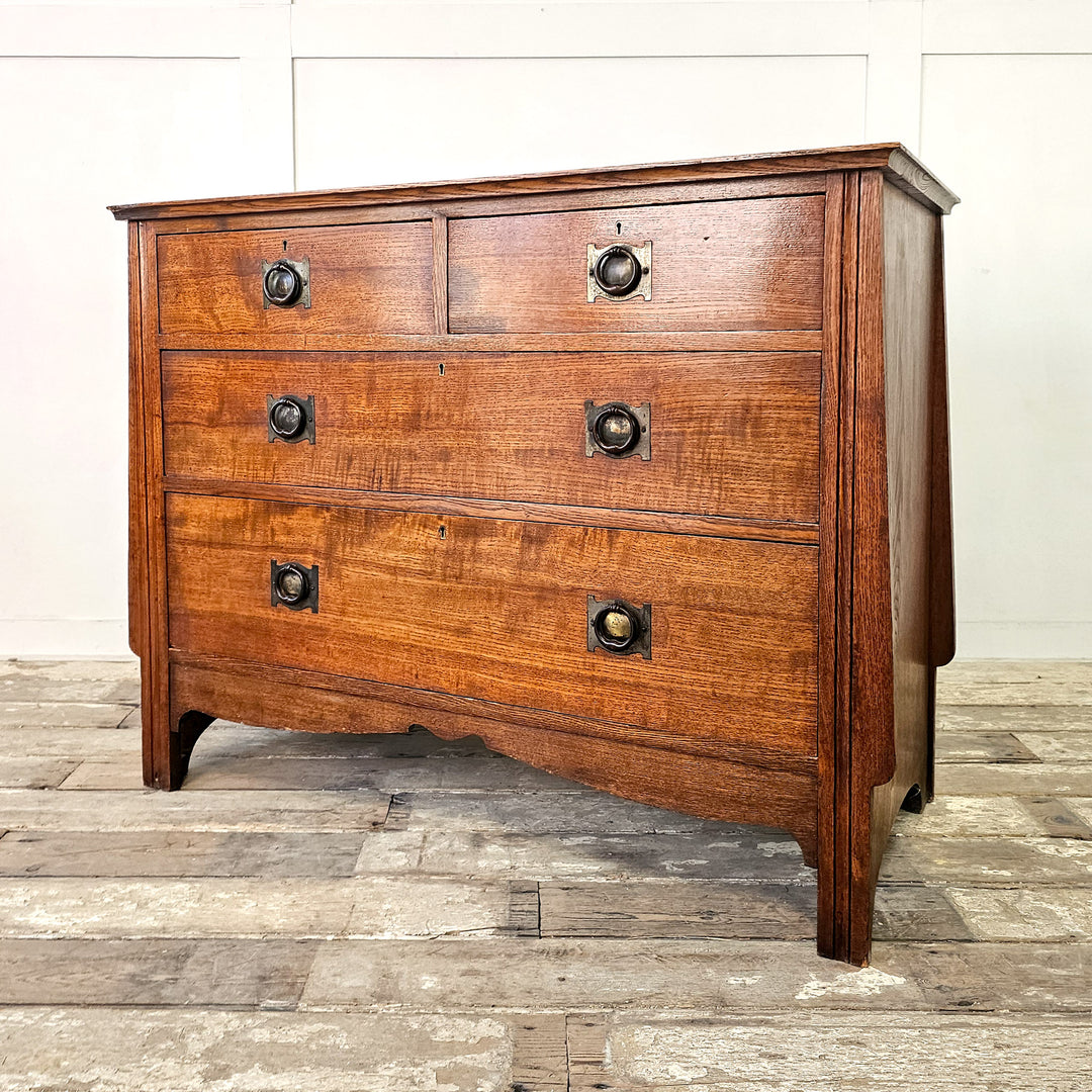 Antique oak chest of drawers with two over two layout
