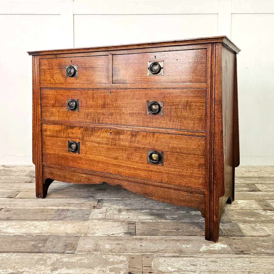 Antique oak chest of drawers with two over two layout
