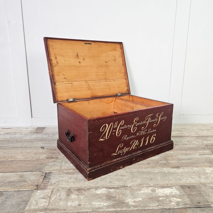 Antique pine storage chest with Friendly Society inscription.

