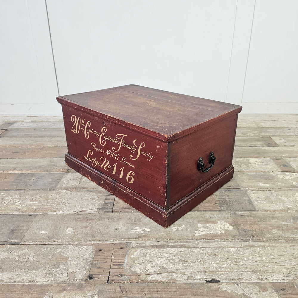 Antique pine chest featuring hand-painted lettering.
