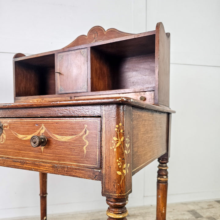 Decorative Victorian desk with gallery drawers and central cupboard