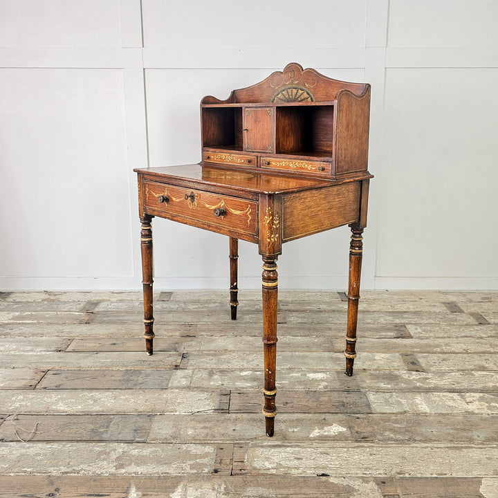 Antique writing desk with single frieze drawer and compact proportions
