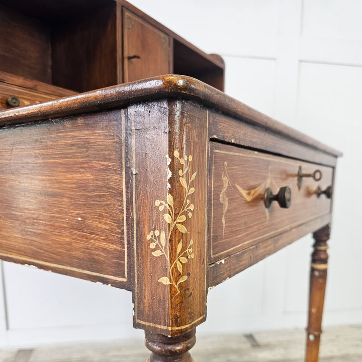 Victorian desk with turned legs, gallery top, and pigeonholes
