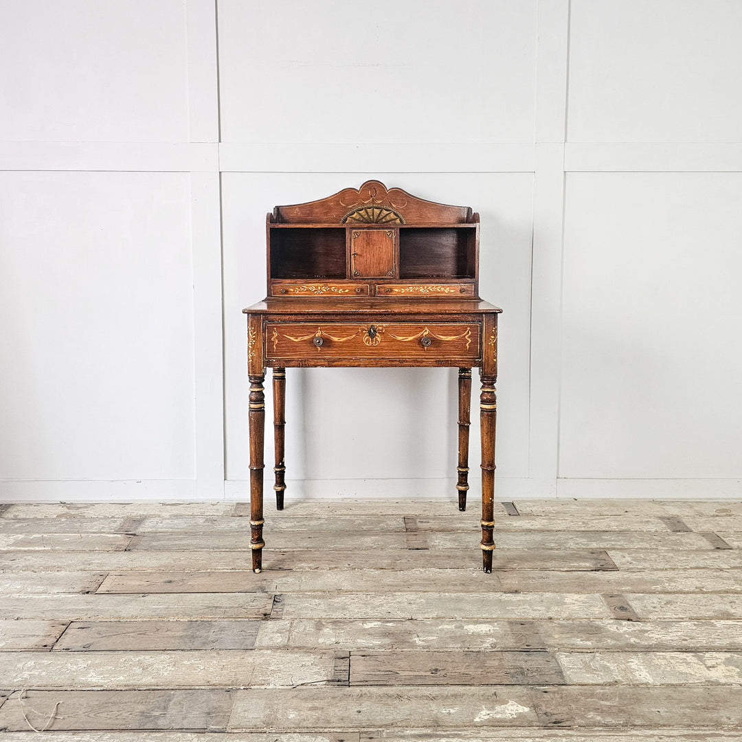 Small antique desk with tall turned legs and scumble painted finish
