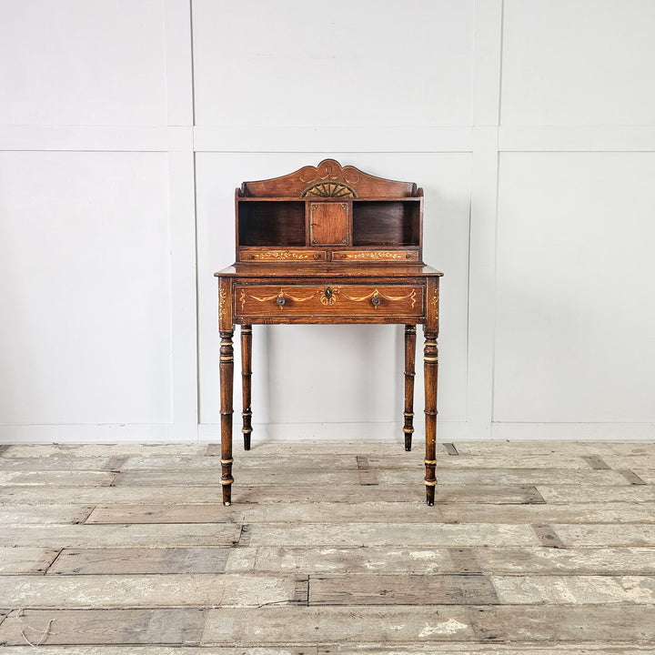 Small antique desk with tall turned legs and scumble painted finish
