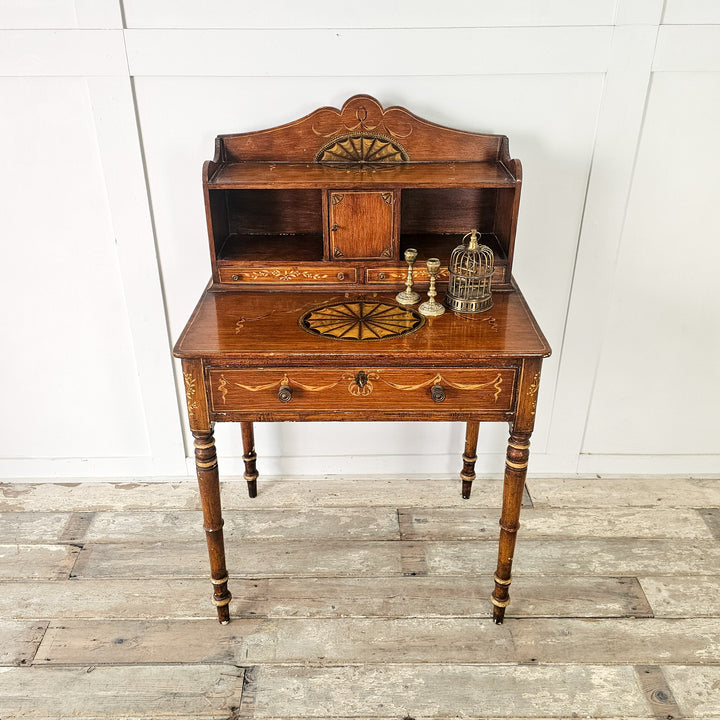 Vintage pine writing desk with painted gallery and drawer storage
