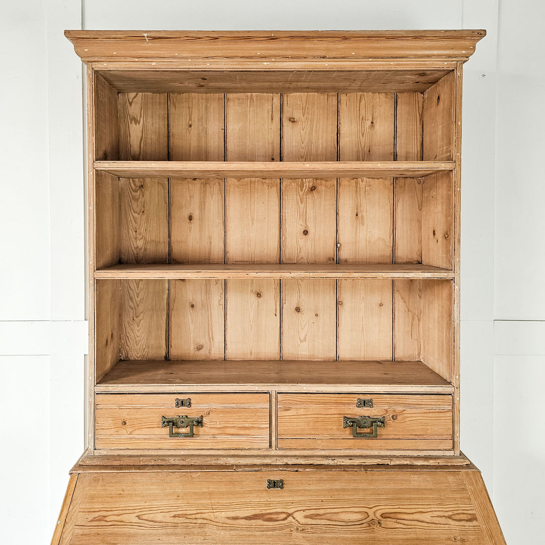Early 20th-century pine bookcase with cupboard and drawers.