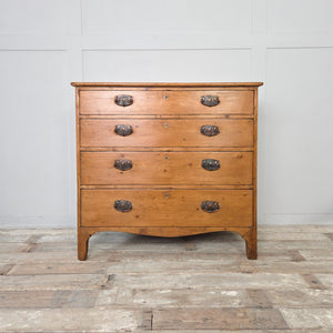 Antique pine four drawer chest from the Georgian period, featuring graduating drawers, brass plate drop handles and ogee style feet, suitable as bedroom drawers or a sideboard.