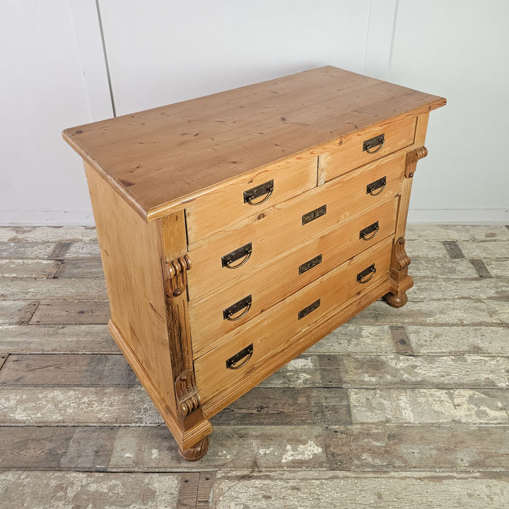 Wooden chest with block feet and smooth drawers.