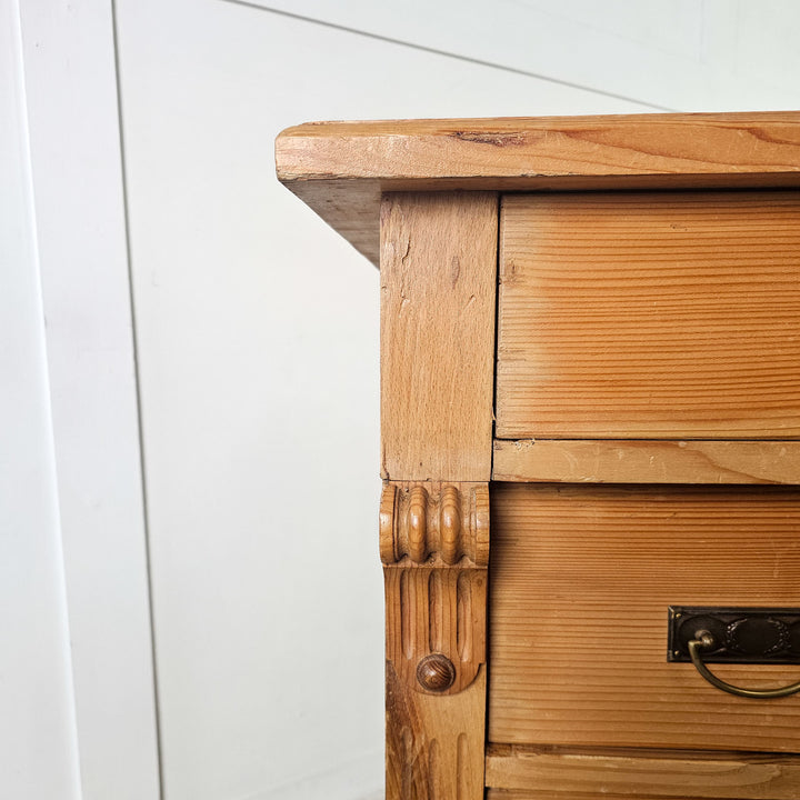 Decorative pine chest of drawers.