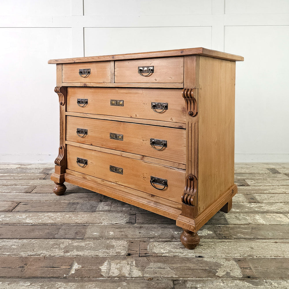 Pine chest of drawers with two-over-three arrangement