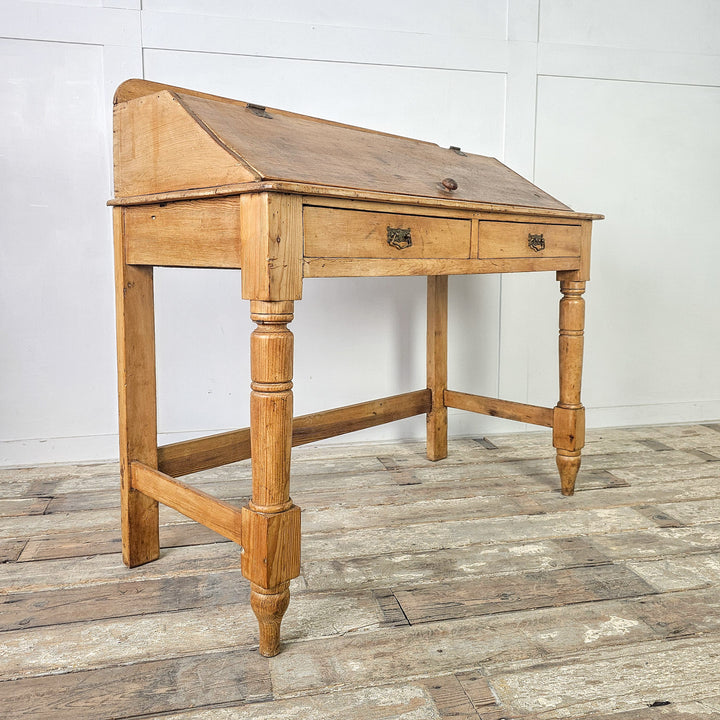 Victorian pine console table with sloped top and two drawers
