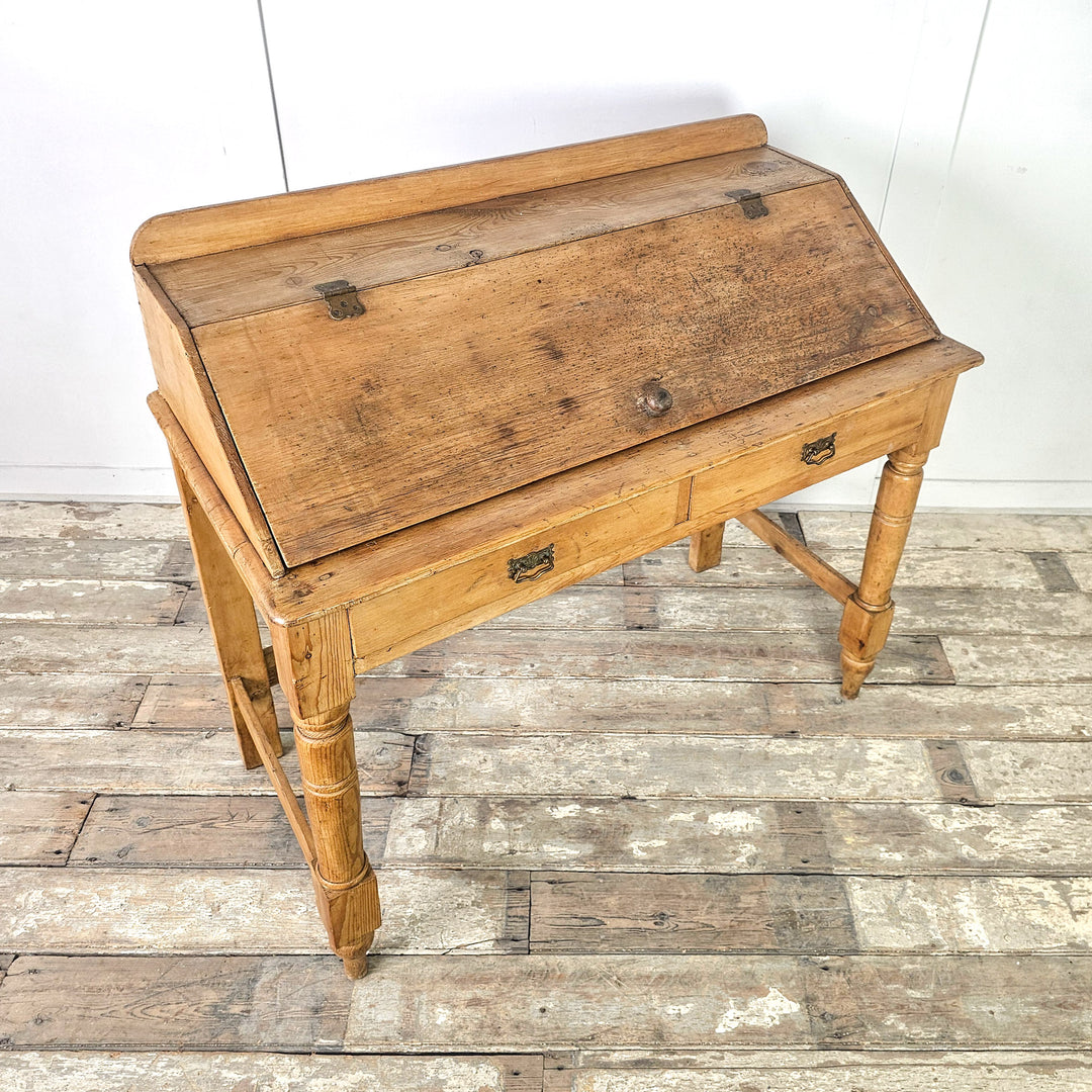 Rustic pine desk with square back legs and simple base
