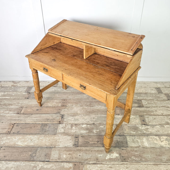 Victorian writing table with plinth-style base and drawers
