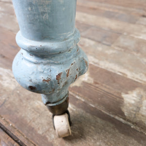 An antique Victorian pine farmhouse table with a scrubbed natural top and painted base finished in a soft powder blue. With a single drawer to the front and castors beneath, it can also be used as a desk in a home office or study.