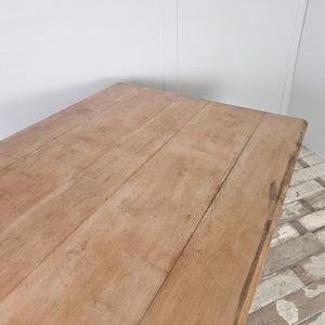 A painted pine farmhouse kitchen table featuring black painted base and a planked beech top.  It has two drawer sta each end offering sotrage for smaller  items.  Perfect for use as a dining table or prep table in the kitchen.