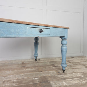 A 19th century pine farmhouse table with a scrubbed natural pine top and painted base in a powder blue finish. Standing on turned legs with a front drawer, it can be used as a desk or writing table.