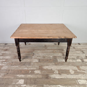 A 19th century farmhouse kitchen table featuring a rectangular hardwood top with a moulded edge and a painted base on turned legs. The two drawers, one at each end, make it useful for everyday kitchen storage and food preparation.