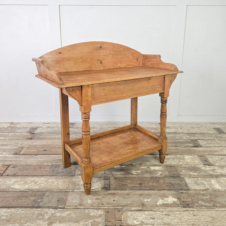 Victorian-era washstand with rustic appeal and elegant silhouette