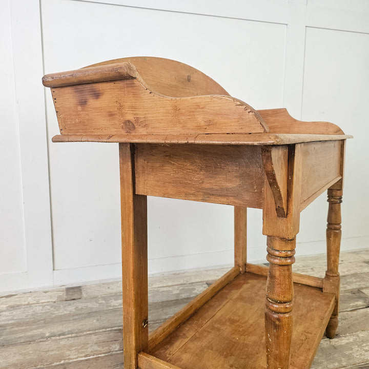 Pine console table with shaped gallery
