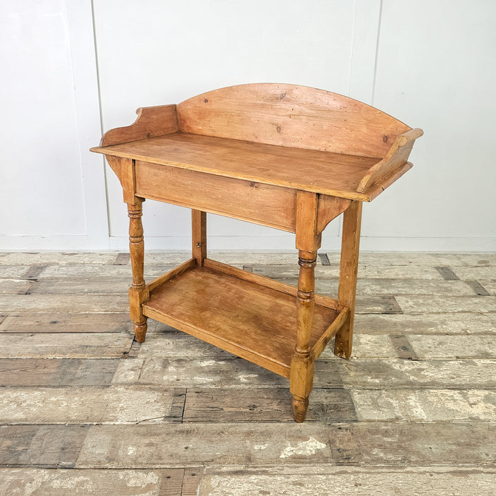 Compact antique table in stripped pine