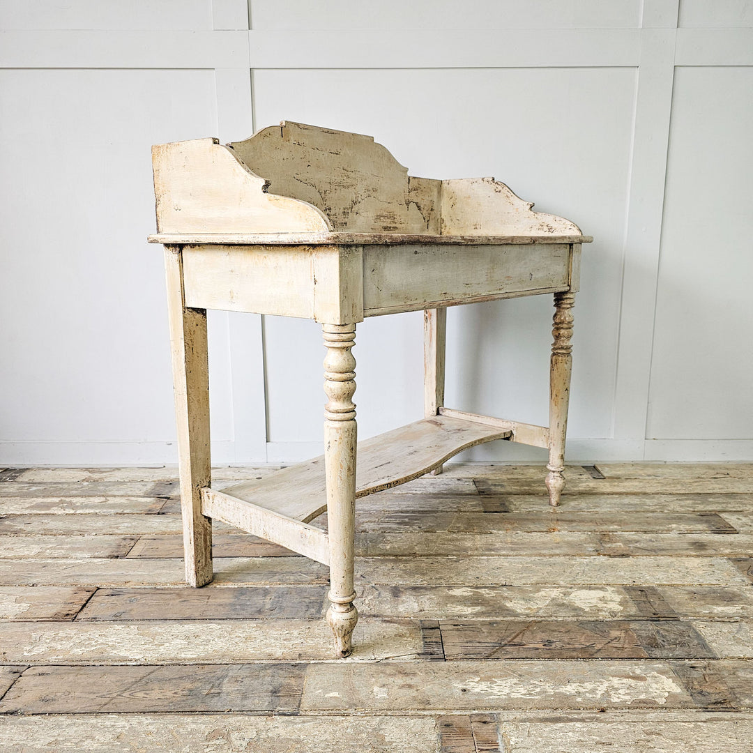 Rustic pine washstand from the Victorian Era, featuring straight and turned legs.
