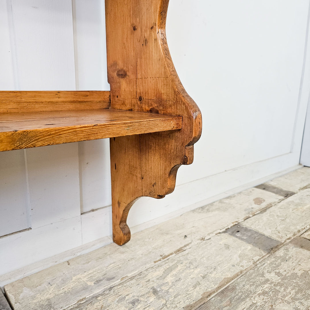 English pine plate rack with a rustic finish.