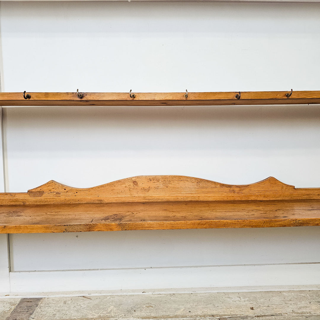 Victorian pine wall shelf with aged wood texture.