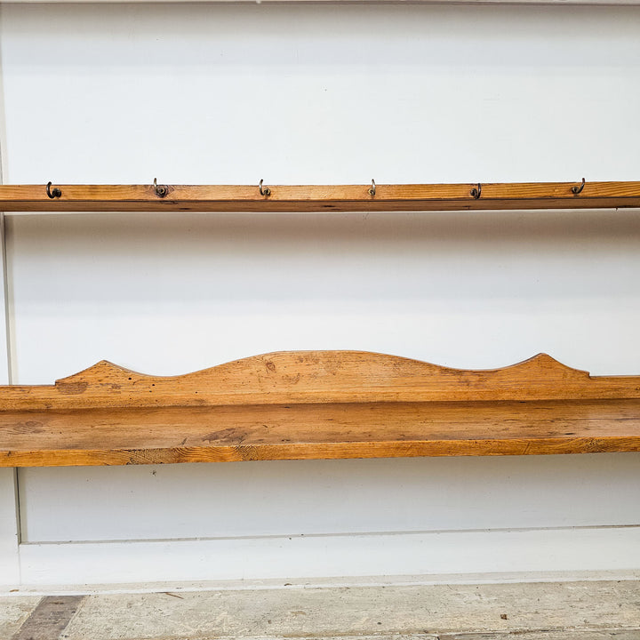Victorian pine wall shelf with aged wood texture.