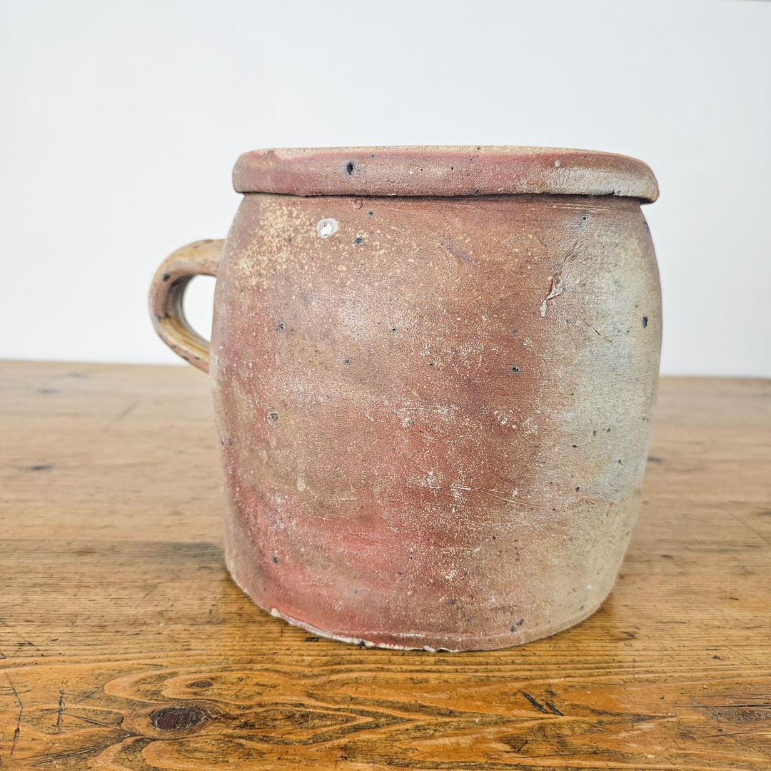 19th-century French rillette pot with a sturdy handle and glazed finish.