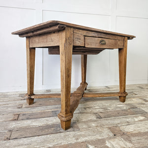 "18th-century rustic table with wax-sealed finish."
