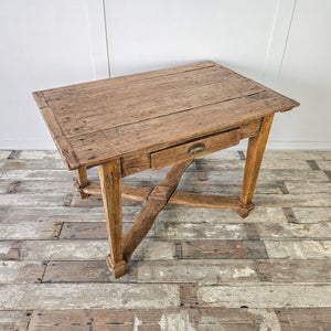 "Rustic dining table from 18th-century France with drawer."
