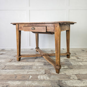 "Antique fruitwood table with decorative stretcher and straight legs."
