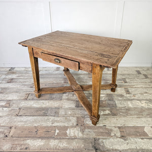 "Traditional French table with storage drawer and quad stretcher."

