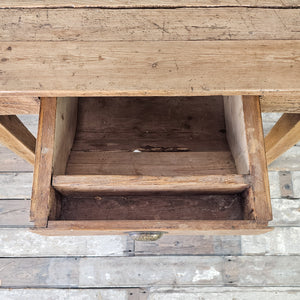 "Rustic fruitwood table with medium brown wax for durability."