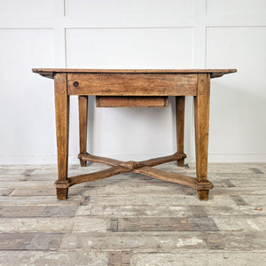 "Antique fruitwood dining table with rustic charm."
