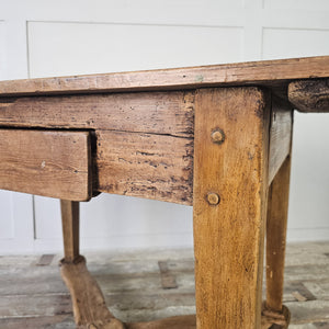 "Crafted French table with drawer for practical storage."
