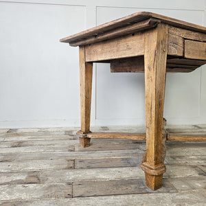 "Traditional French table with storage drawer and quad stretcher."
