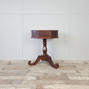 Victorian sewing table with chip carved flowers and fruit baskets across lid and side panels
