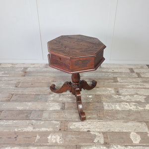 Cottage style antique oak sewing table with carved decoration and tripod scrolled base
