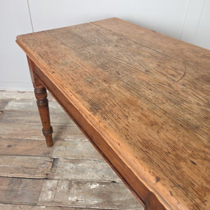 Antique Victorian farmhouse table crafted in pine with a stripped top and decorative turned legs, featuring a single fitted drawer. A versatile rustic piece that works as a small kitchen or dining table, or as a hall table or side table in a country-style interior.
