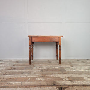 Antique Victorian pine farmhouse table with rustic stripped pine top, turned legs, and original drawer knob. A versatile piece of country pine furniture, perfect as a small dining or kitchen table, or as a practical side table in a hallway or farmhouse-style living room.