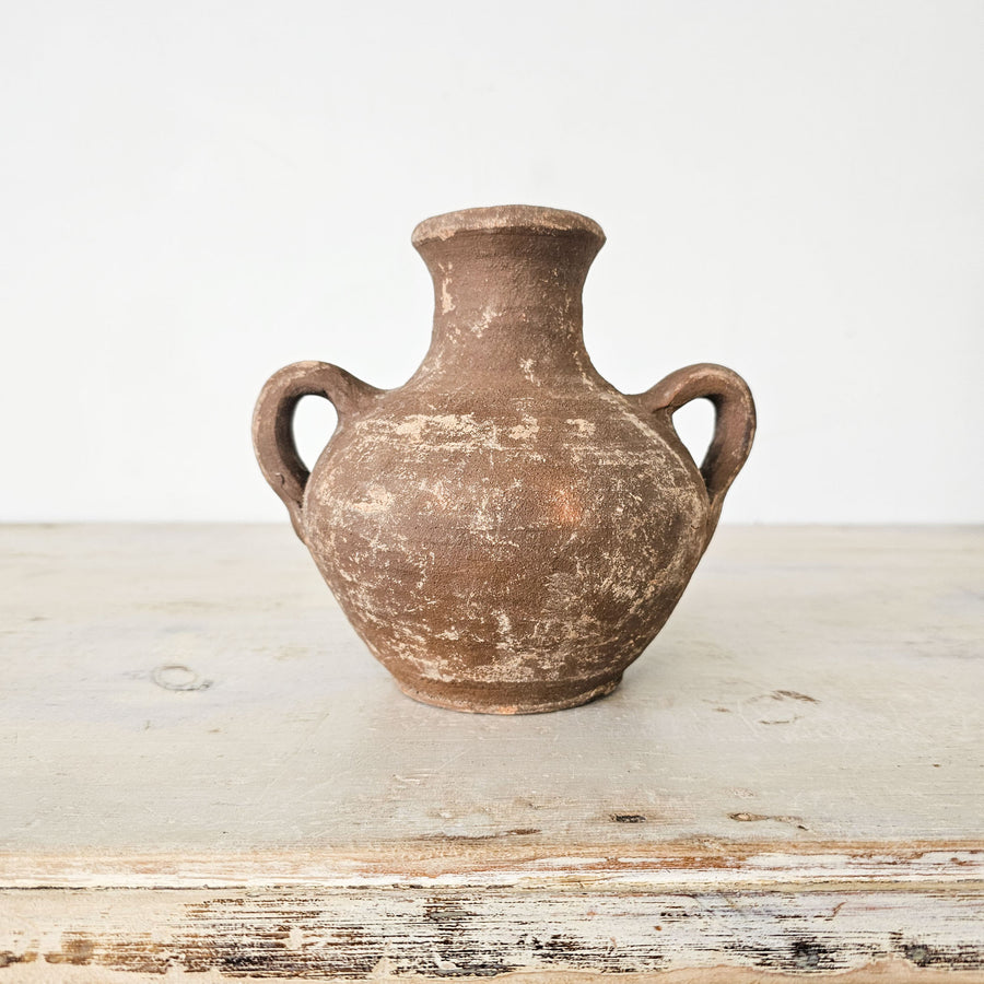 Handmade Turkish earthenware pot with rustic amphora style and two small handles.
