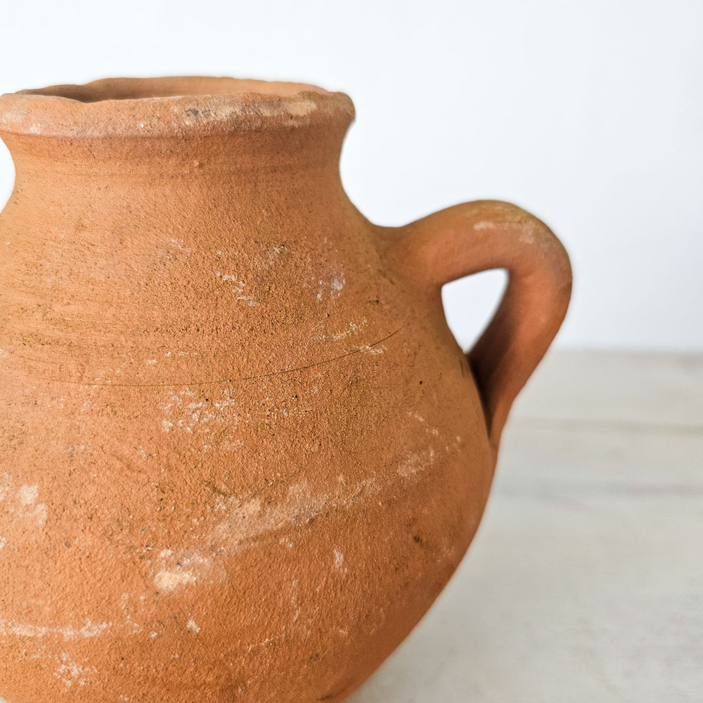 Rustic earthenware vessel crafted in Turkey with charming patina.