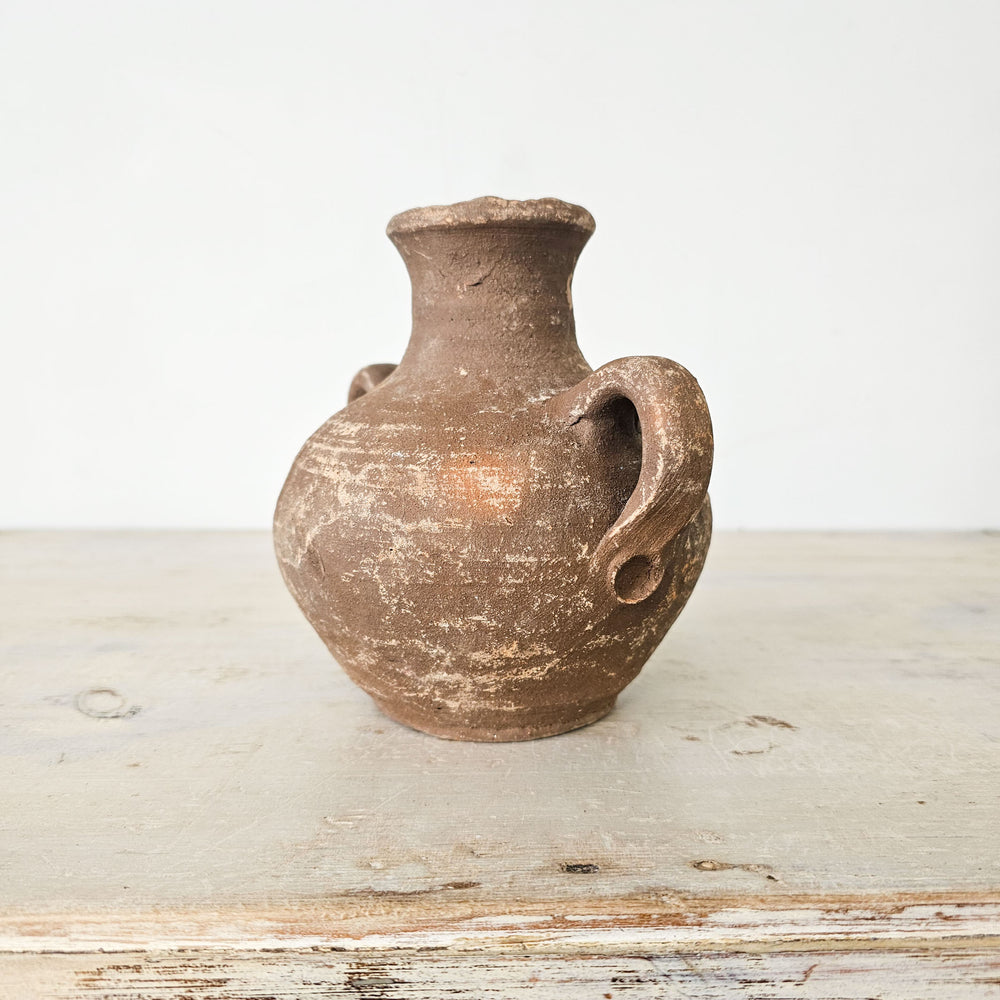 Rustic earthenware jar crafted in Turkey, featuring a charming patina and traditional design.