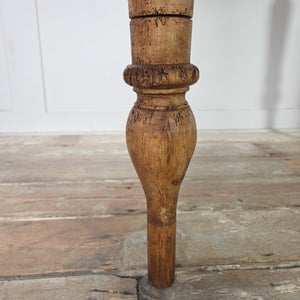 A small 19th-century pine farmhouse table featuring a two-plank top with rounded edges, supported by turned legs with later timber extensions at the base. The simple apron and pine finish make this country-style table a practical option for hallways or limited kitchen spaces.