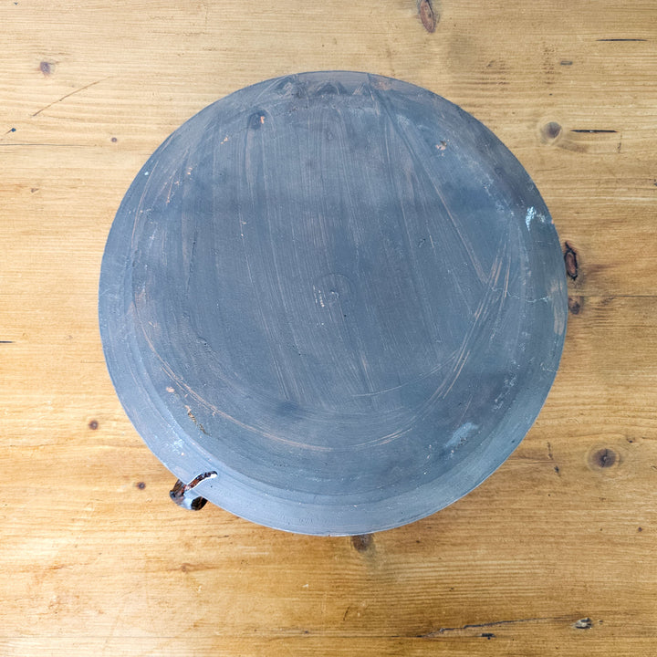 Terracotta cooking pot, perfect for slow-simmered dishes.
