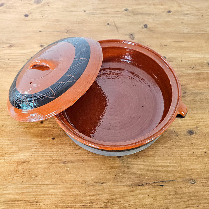 Traditional Spanish cookware with a distinctive glazed finish.
