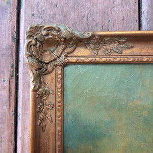 The framed art piece features a Victorian still life composition of roses and fruit, painted in oil on canvas and enclosed in an ornate gilt frame with surface detail consistent with the period.
